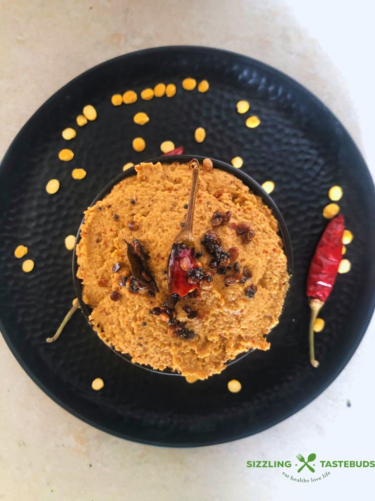 Paruppu Thogyal is a spicy, tangy South Indian Lentil Chutney. Served with hot steamed rice and sesame oil