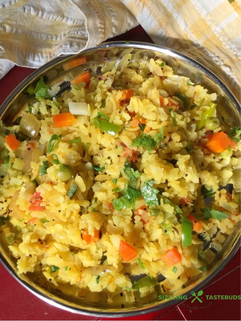 Vegetable Poha is a healthy and filling Gluten Free Vegan Breakfast or brunch dish made with flattened rice and lots of veggies. Perfect for lunchboxes too!