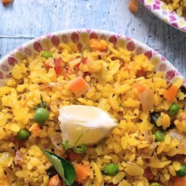 Vegetable Poha is a healthy and filling Gluten Free Vegan Breakfast or brunch dish made with flattened rice and lots of veggies. Perfect for lunchboxes too!