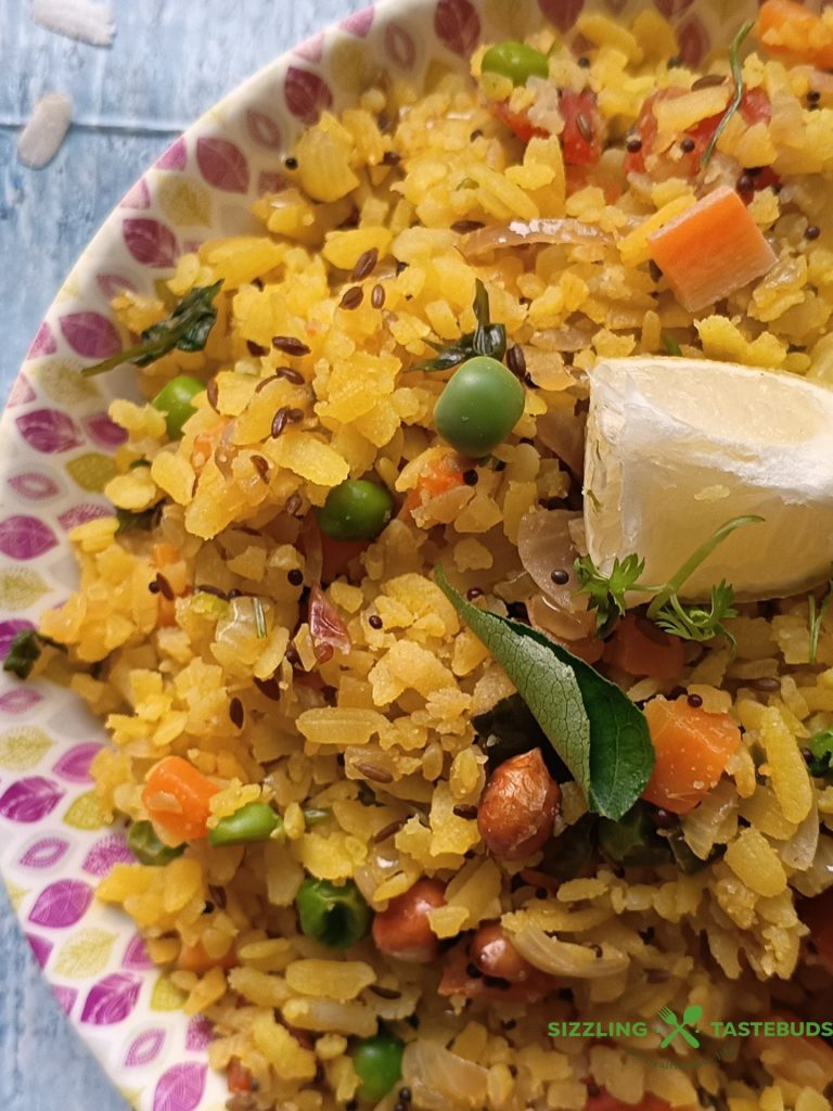 Vegetable Poha is a healthy and filling Gluten Free Vegan Breakfast or brunch dish made with flattened rice and lots of veggies. Perfect for lunchboxes too!
