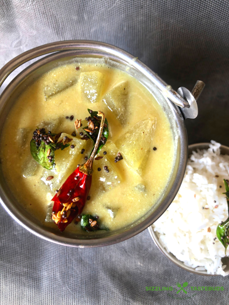 Kumbalakayi majjigehuli is ashgourd yoghurt curry made in Karnataka cuisine. Served with hot steamed rice and a dry saute on the side.
