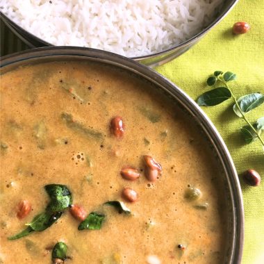 Pudalangai Paal Kootu is a rustic, Gluten Free Vegan + Curry made with snake gourd, Coconut milk and a spice paste. Served with steamed rice or Chapati.