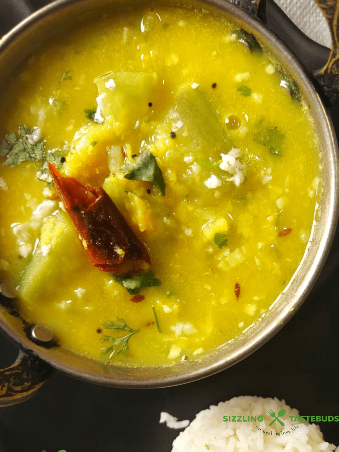 A no-onion, no garlic dal made with bottle gourd and cooked lentils. Tempered with basic kitchen spices. Served with steamed rice / Roti (Flatbreads)